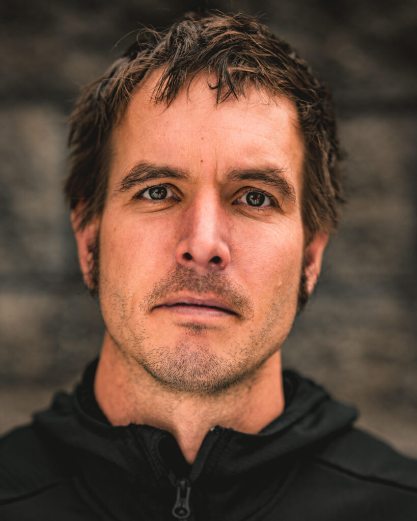 Close up of Zeke Baker's face against a blurred brown background